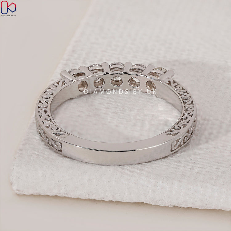 Prong set wedding band with secure diamonds for maximum sparkle and style.