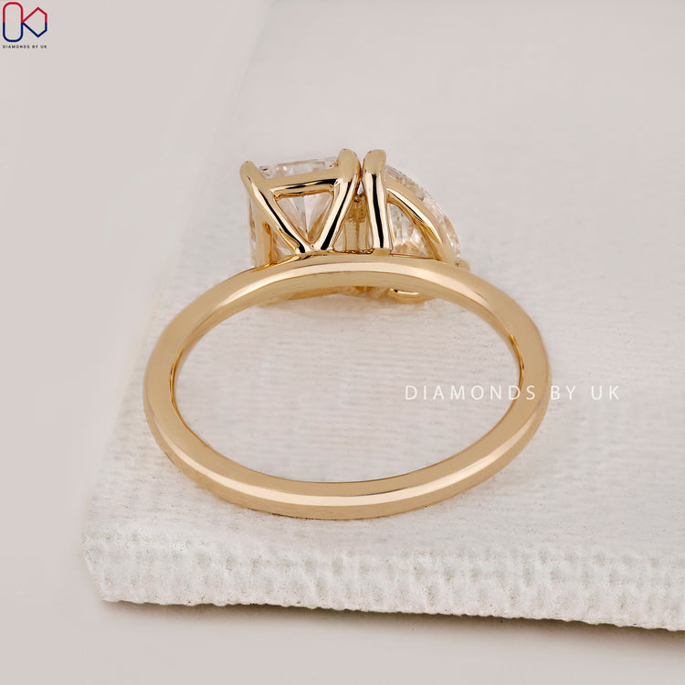 Diamondsbyuk ring with pear and radiant cut diamonds.
