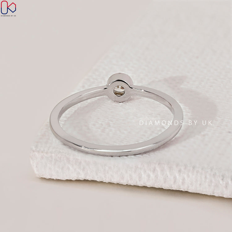 Diamondsbyuk ring featuring a round cut diamond.
