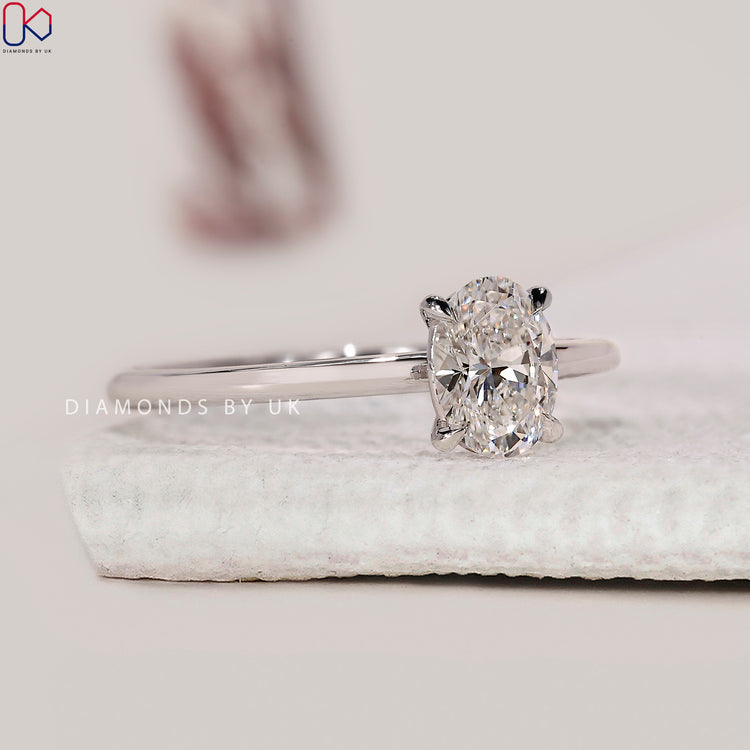 Diamond engagement ring with oval solitaire engagement ring.
