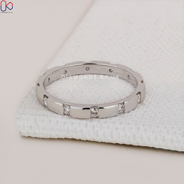 Handmade jewelry featuring gypsy set diamond band.
