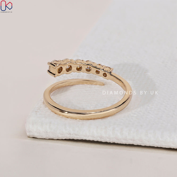 Shared prong wedding band designed to enhance the sparkle of each diamond.
