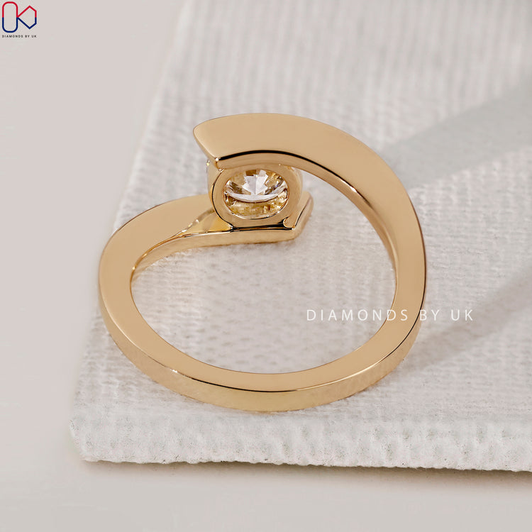 Diamondsbyuk engagement ring with bypass style and lab grown solitaire brilliance.