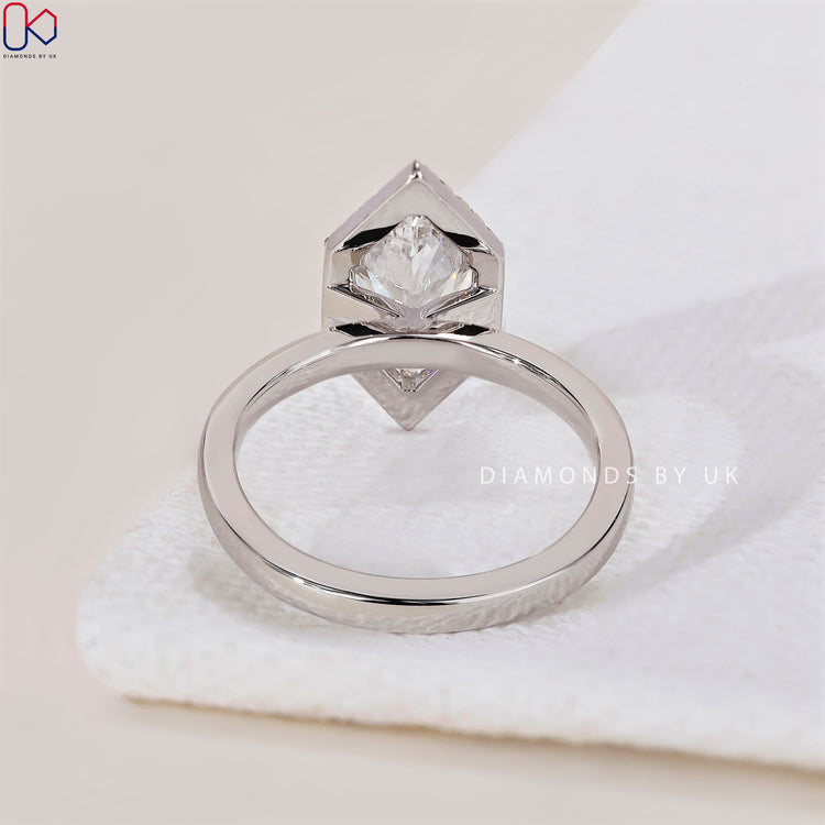 Handmade ring featuring a Dutch Marquise and halo diamond setting.
