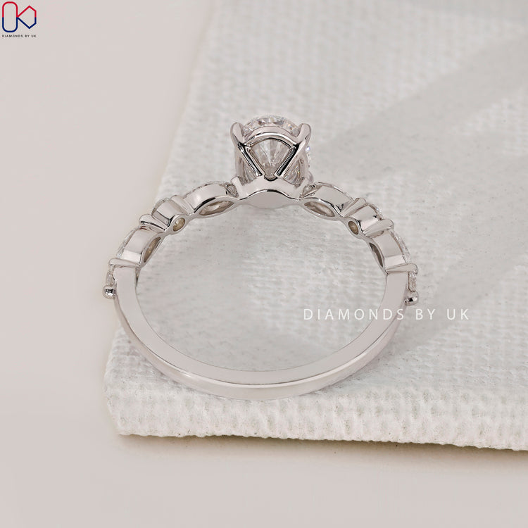 Diamondsbyuk engagement ring with oval, marquise, and round diamonds for a refined look.