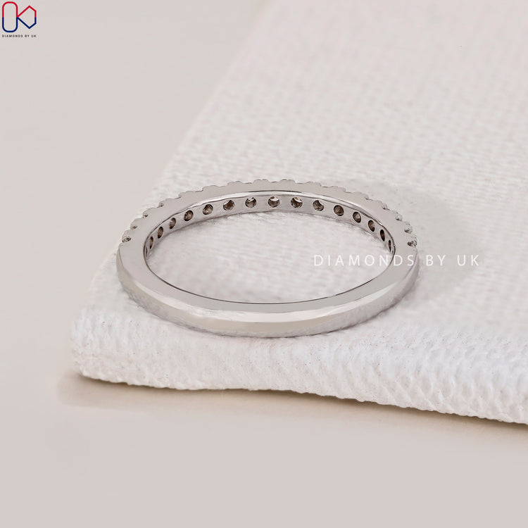 Handmade jewellery band crafted from white gold and diamonds.
