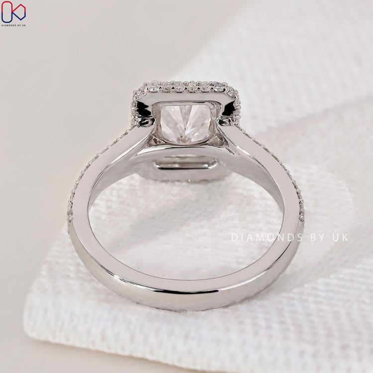 Diamondsbyuk ring with radiant cut diamonds in a beautiful halo setting.