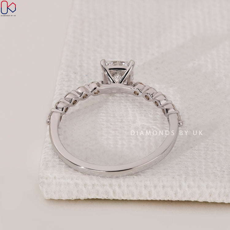 Shared prong cushion eternity ring from Diamondsbyuk in handmade white gold.