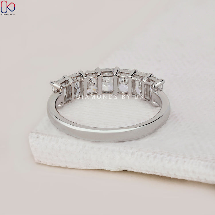 Handmade band with radiant cut diamonds for a wedding look.
