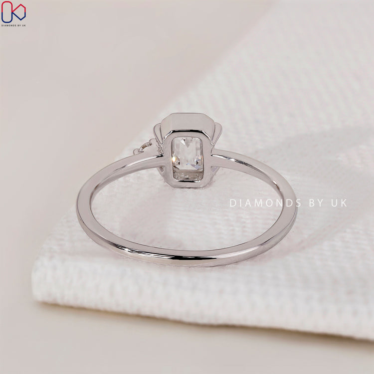 White gold ring with two stunning diamonds in a bezel setting.