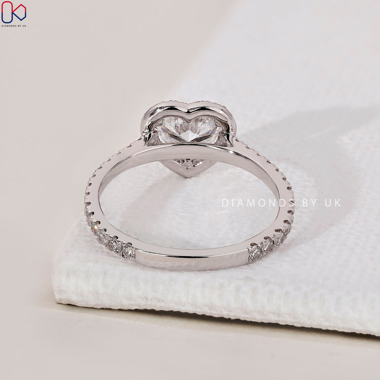 White gold diamond ring with a heart cut diamond centrepiece.