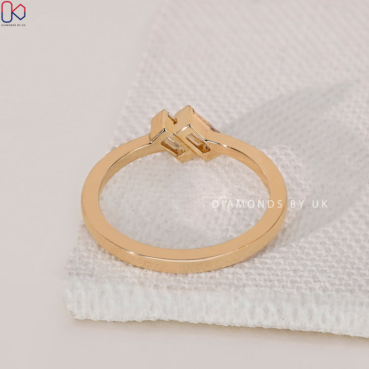 Engagement Ring UK with two baguette diamonds, set in a minimalist yellow gold band.