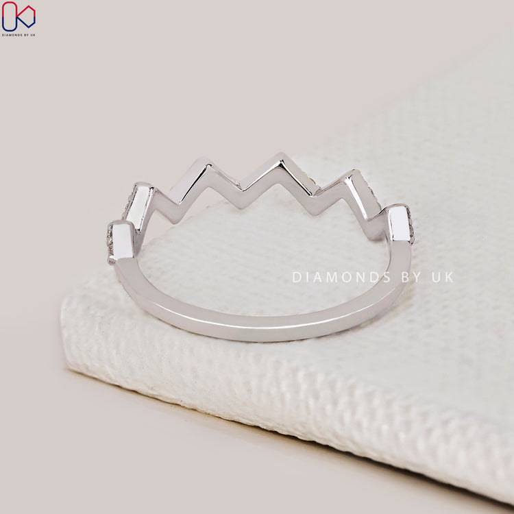 Lab grown diamond band designed in a half eternity setting.
