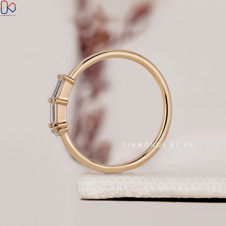 Handmade ring featuring a yellow gold band and dazzling diamonds.
