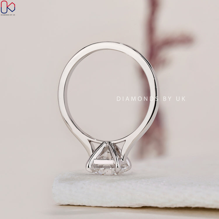 Handmade ring featuring a timeless solitaire diamond setting.
