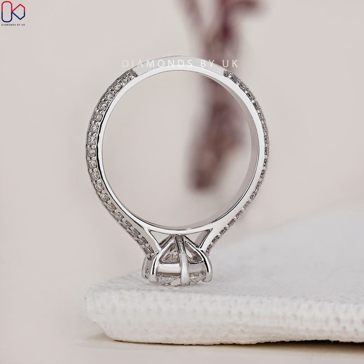 Handmade jewellery showcasing a round cut diamond ring in a classic setting.