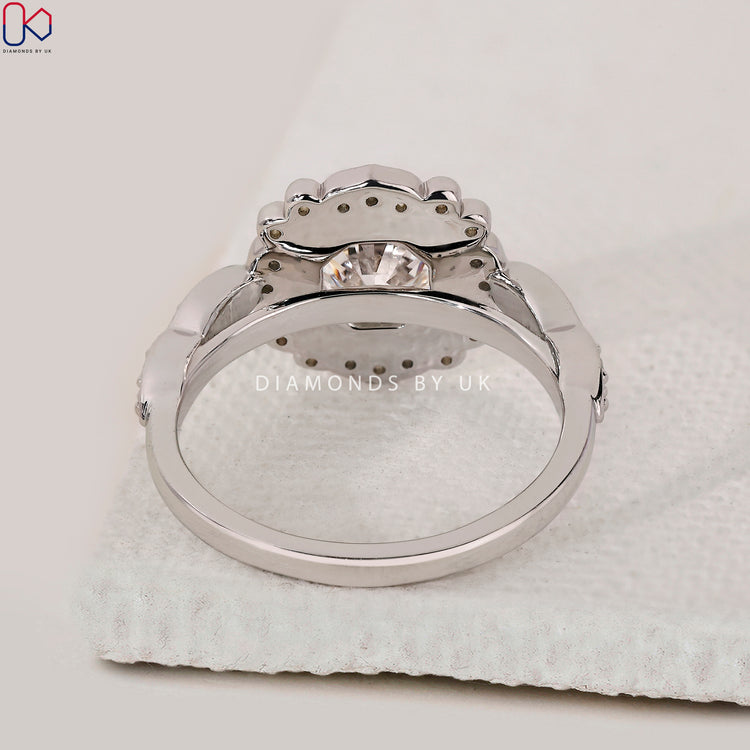 Marquise shape outline band with art deco diamond styling.
