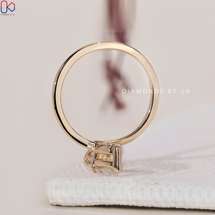 Handmade jewellery with a pear and round diamond ring design.