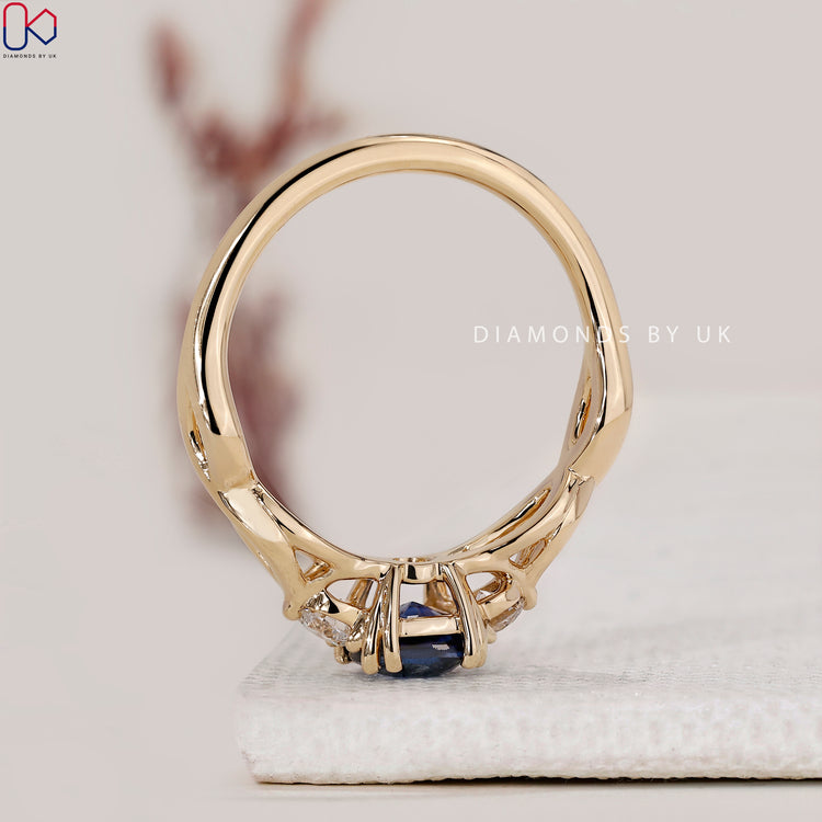 Lab grown blue sapphire engagement ring.
