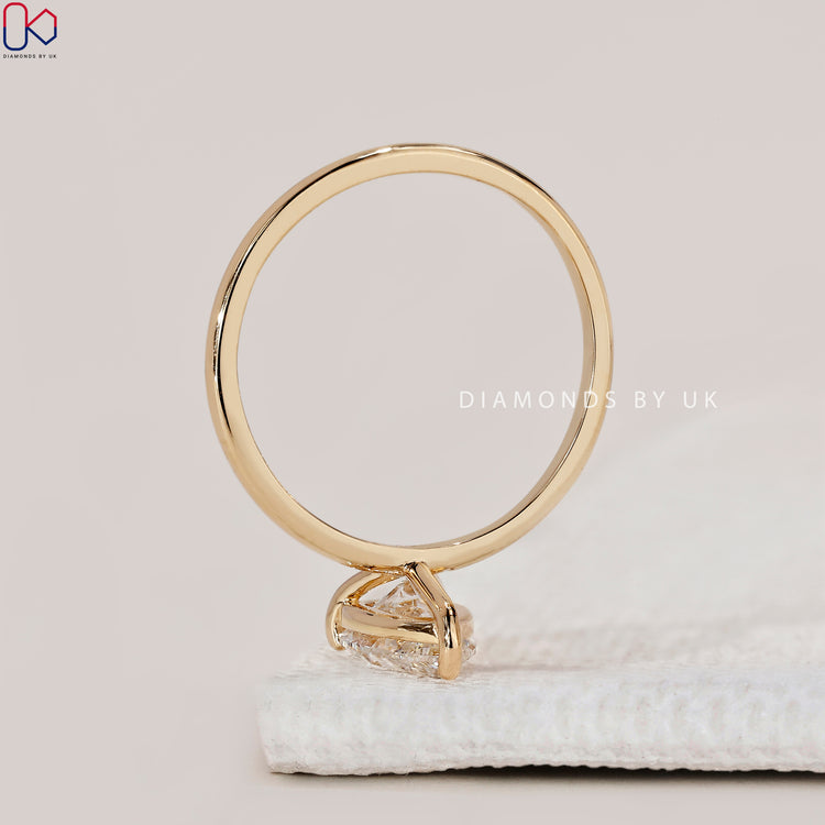 Elegant pear cut diamond ring by Diamondsbyuk.
