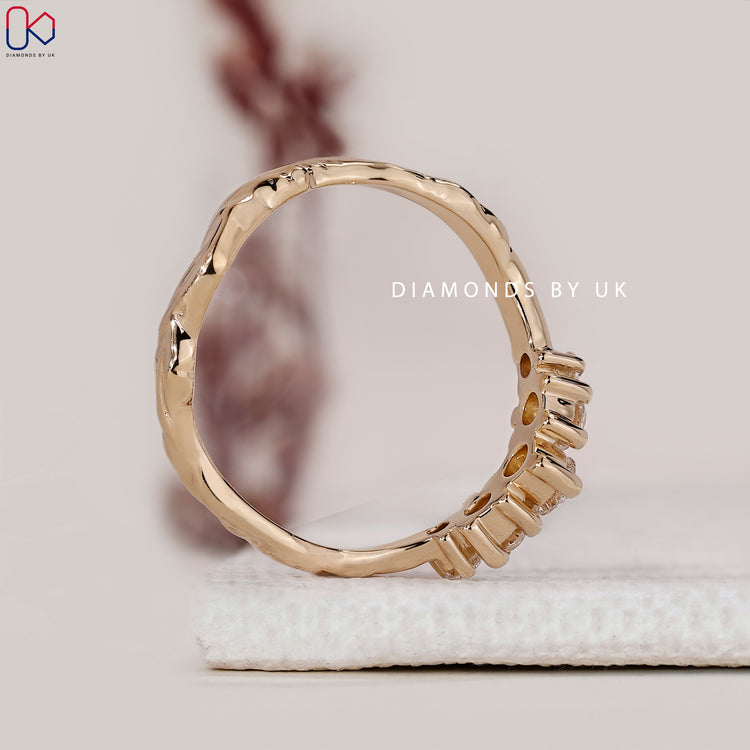 Yellow gold curved round diamond 5 stone wedding band.
