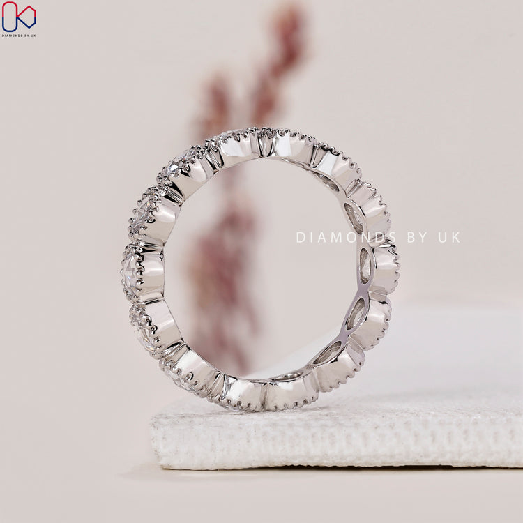 Round diamond eternity band in white gold setting.
