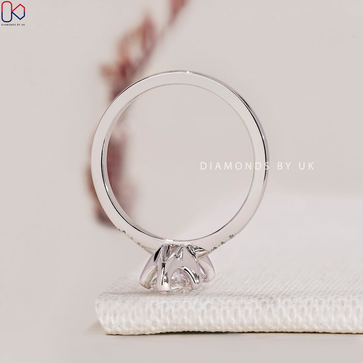 Handmade Ring with Marquise and Round Diamonds, set in a V prong setting with a tapered shank band in white gold.
