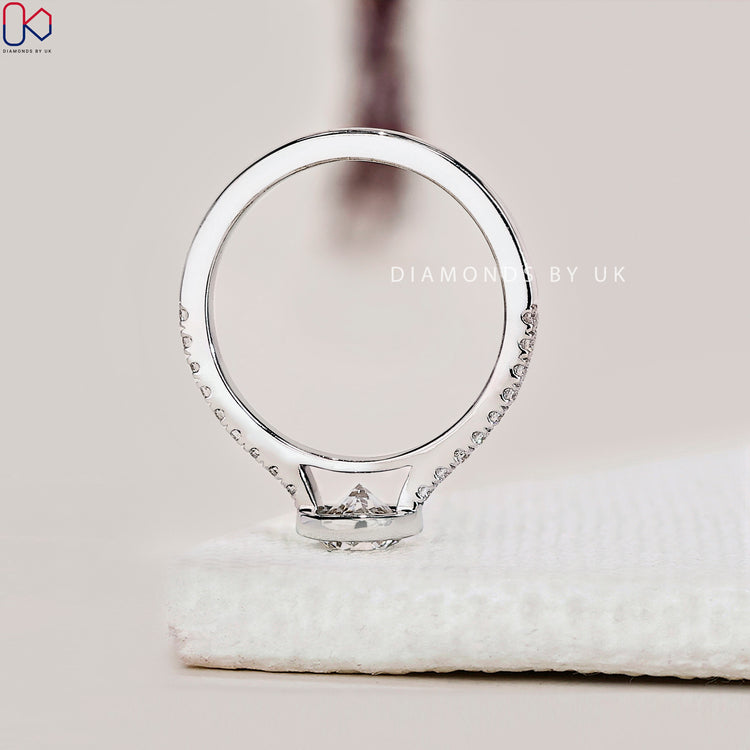 Diamondsbyuk round diamond engagement ring in white gold setting.
