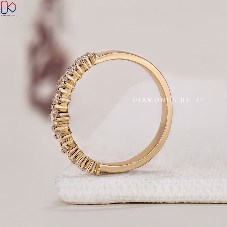 A half eternity diamond wedding band, handmade for a unique and personal touch.