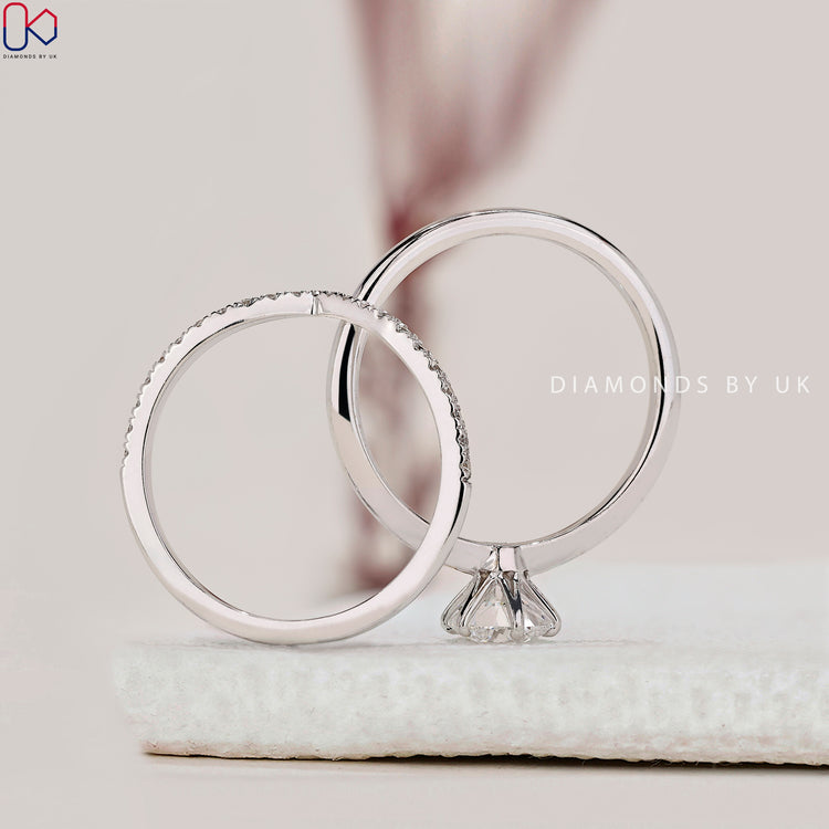 Handmade jewellery featuring round diamond wedding band and solitaire ring.
