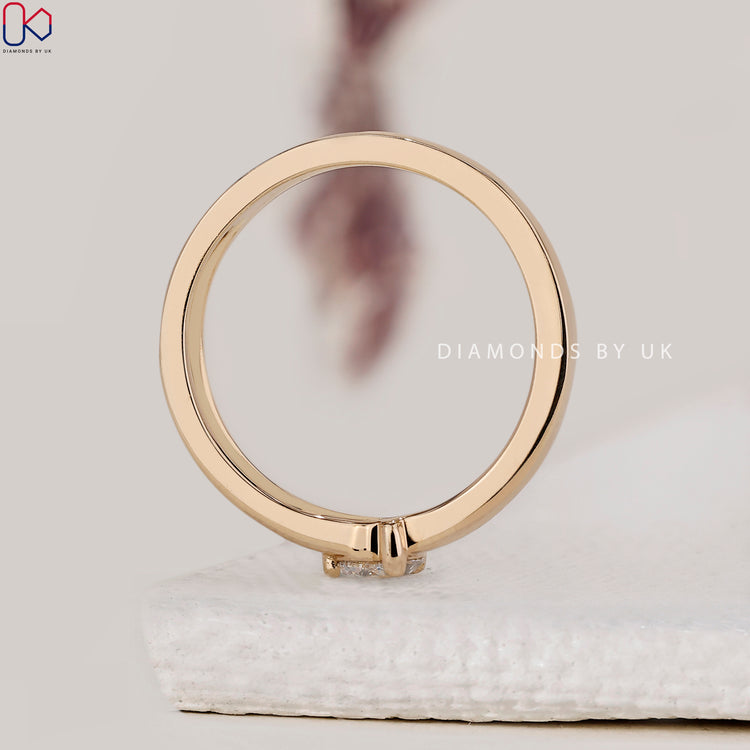 Handmade jewellery featuring a round solitaire engagement ring.

