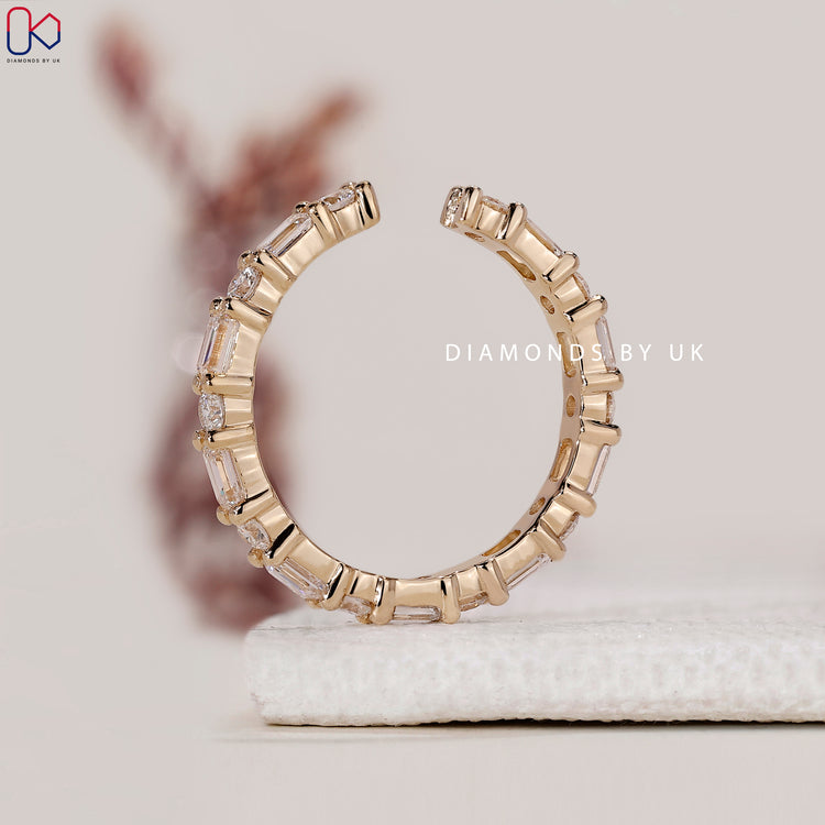 Buy emerald and round diamond wedding band online.
