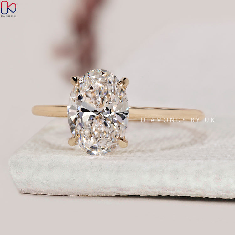 4 claw prong setting ring with lab grown oval diamond.
