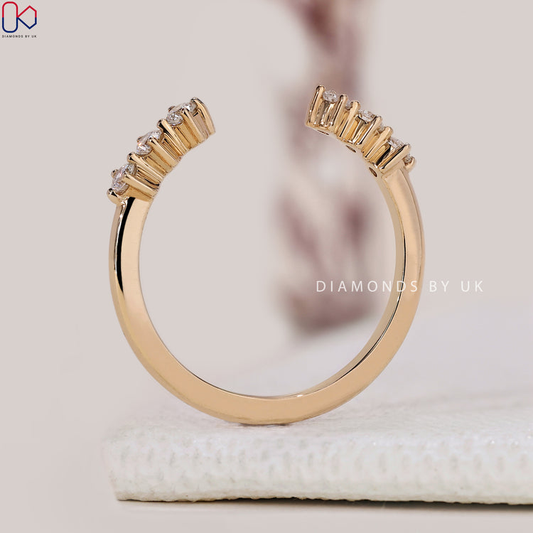 Handmade band with a round cut diamond and prong set design.
