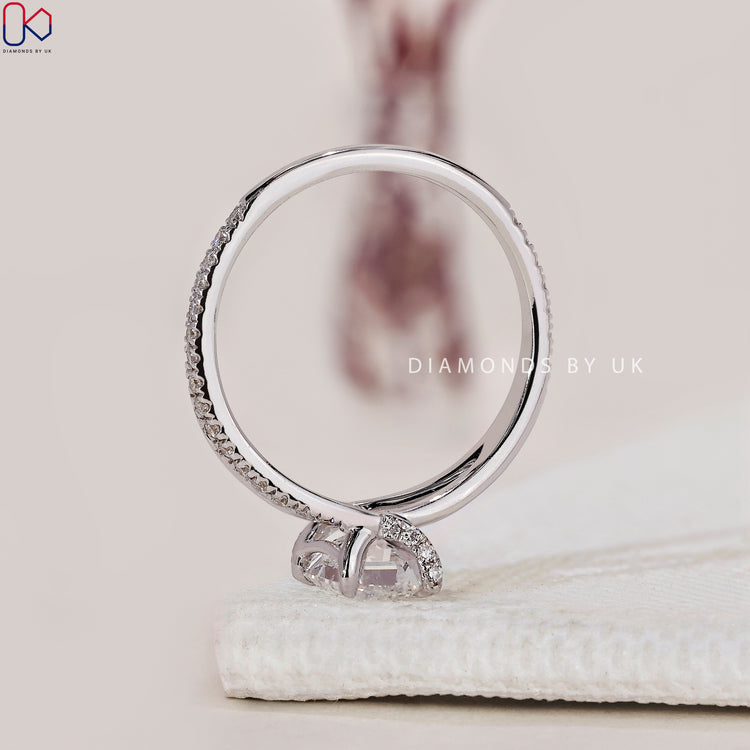 Diamondsbyuk engagement ring with a stunning emerald cut diamond.
