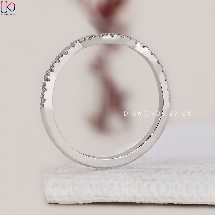 Pave wedding band showcasing intricate diamond detailing and brilliance.