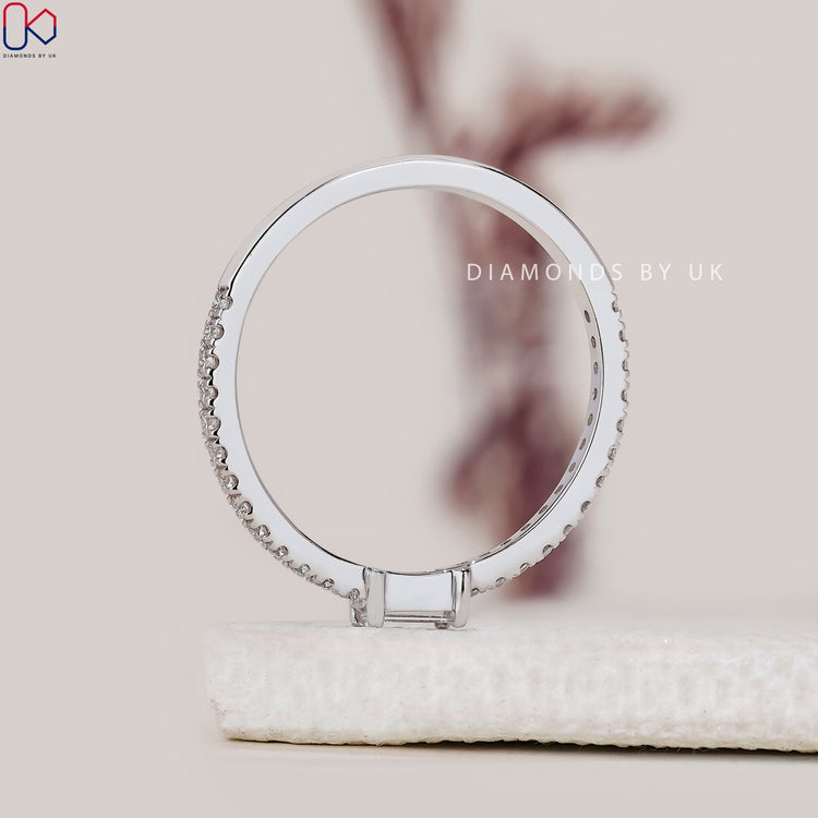 Diamondsbyuk wedding band with prong set round and baguette diamonds.
