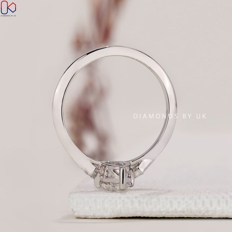 Handmade Ring with marquise and round diamonds, set in white gold with a prong setting.
