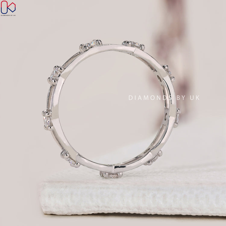 Lab Grown Diamond set in a white gold wedding band finish.
