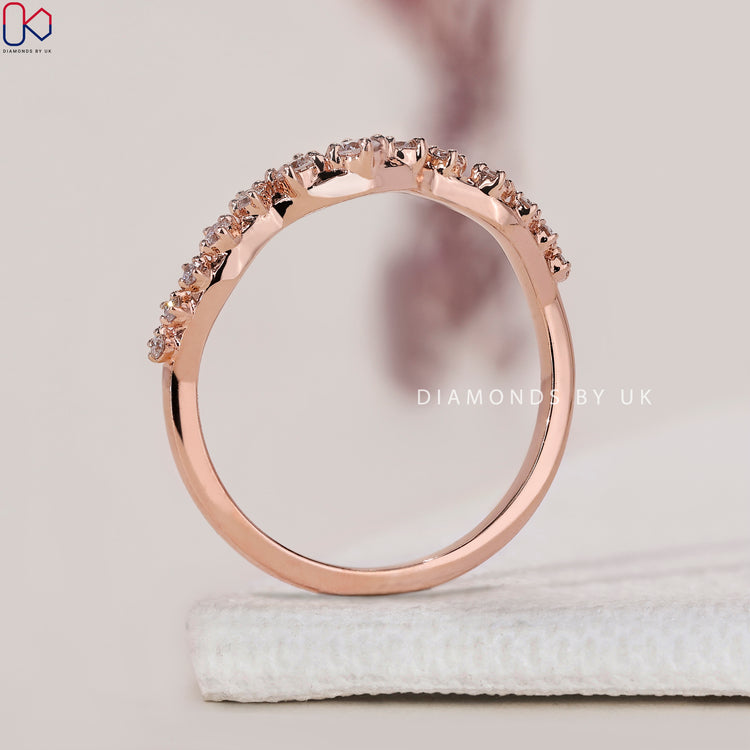 Diamondsbyuk wedding band with prong set round cut diamonds.

