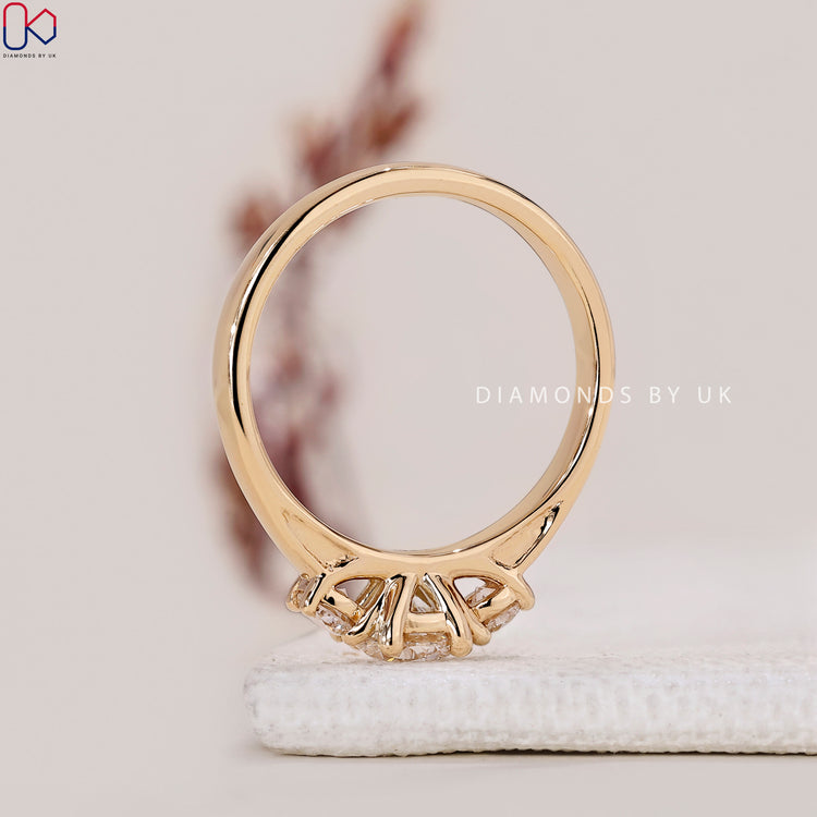 Handmade Jewellery featuring a round cut diamond ring with a wide band in yellow gold.
