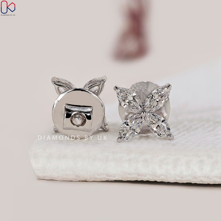 Custom earrings with flower stud design and Lab Grown Diamond.
