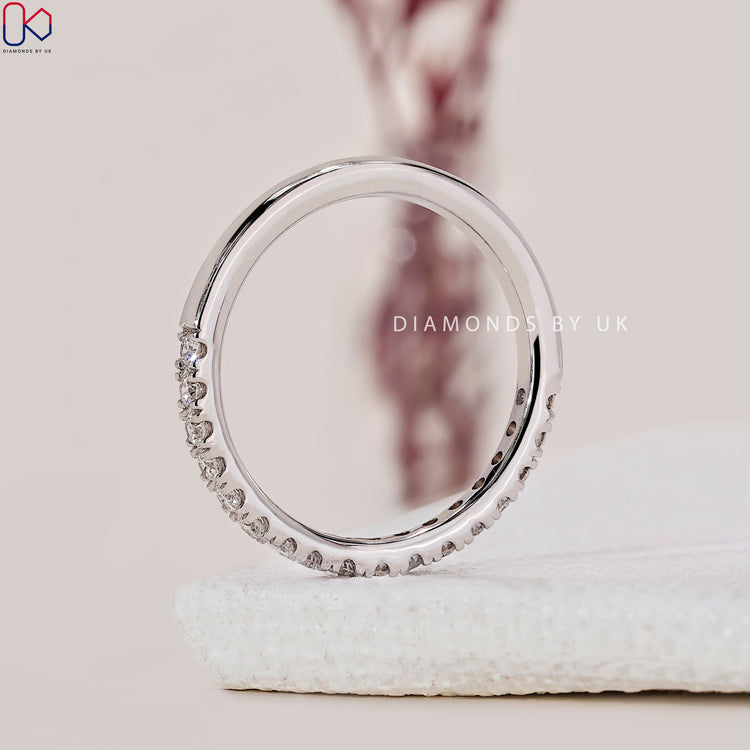 Diamondsbyuk wedding band with minimalist round diamonds.
