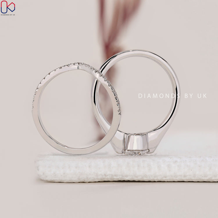 Handmade bridal set with round cut diamond band and curved wedding band.
