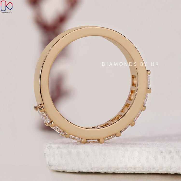 Half eternity band showcasing princess cut diamonds for a modern touch.
