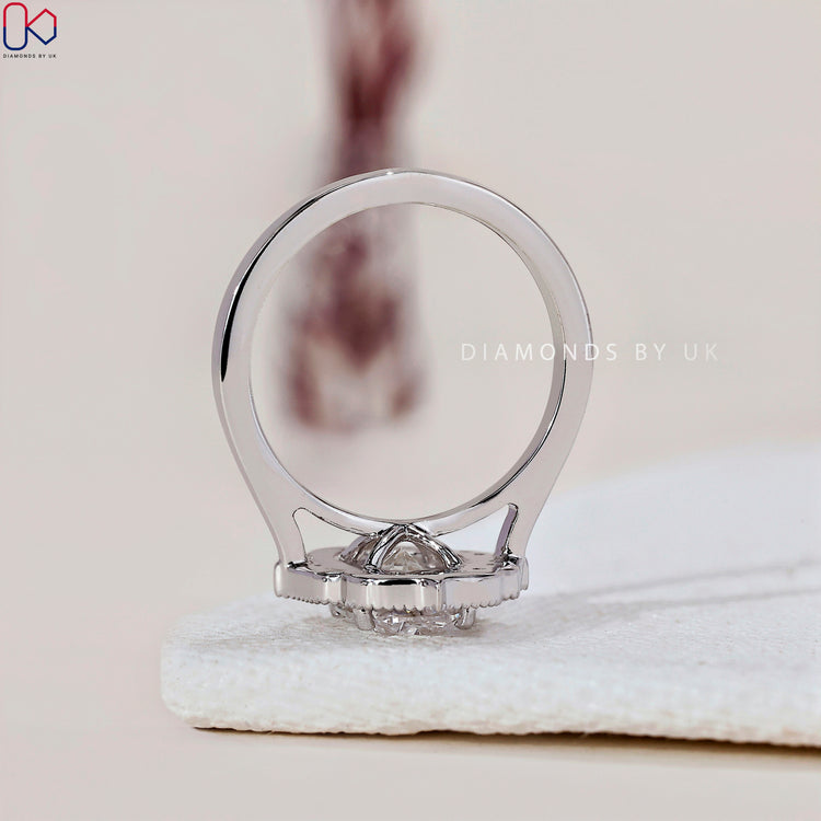 Prong setting ring with a stunning oval halo engagement ring.
