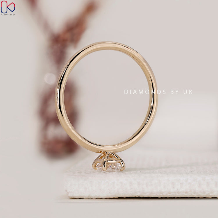 DiamondsbyUK ring showcasing a solitaire design.
