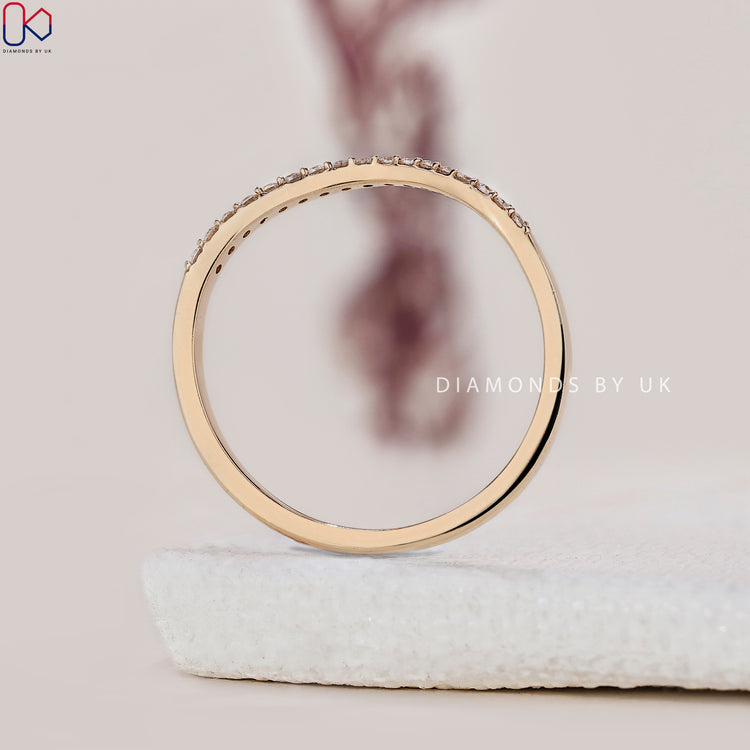 Lab grown diamond band set in a classic yellow gold curve.
