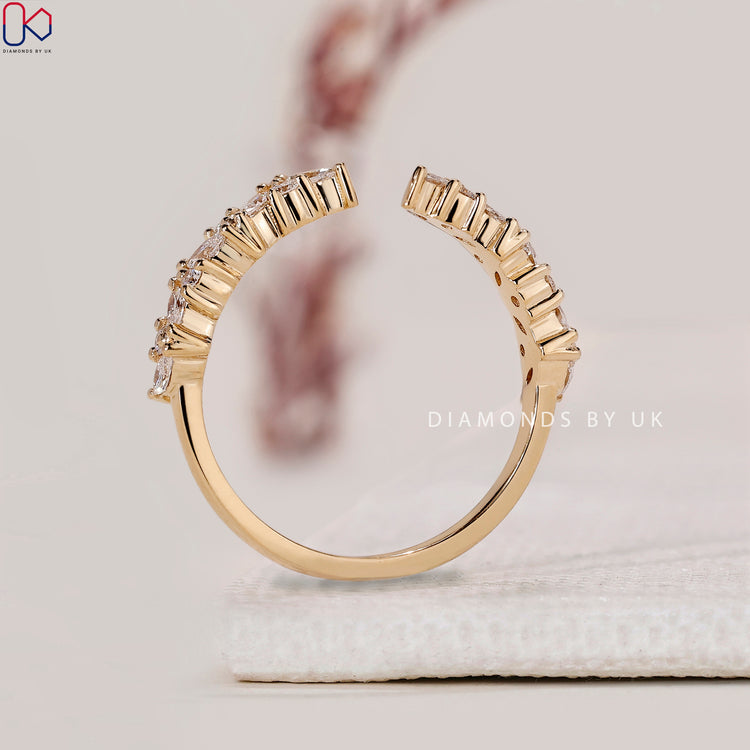 Round cut diamond band with open gap design.
