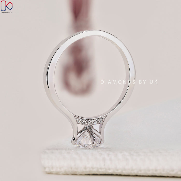 Diamondsbyuk white gold engagement ring with lab-grown diamond.
